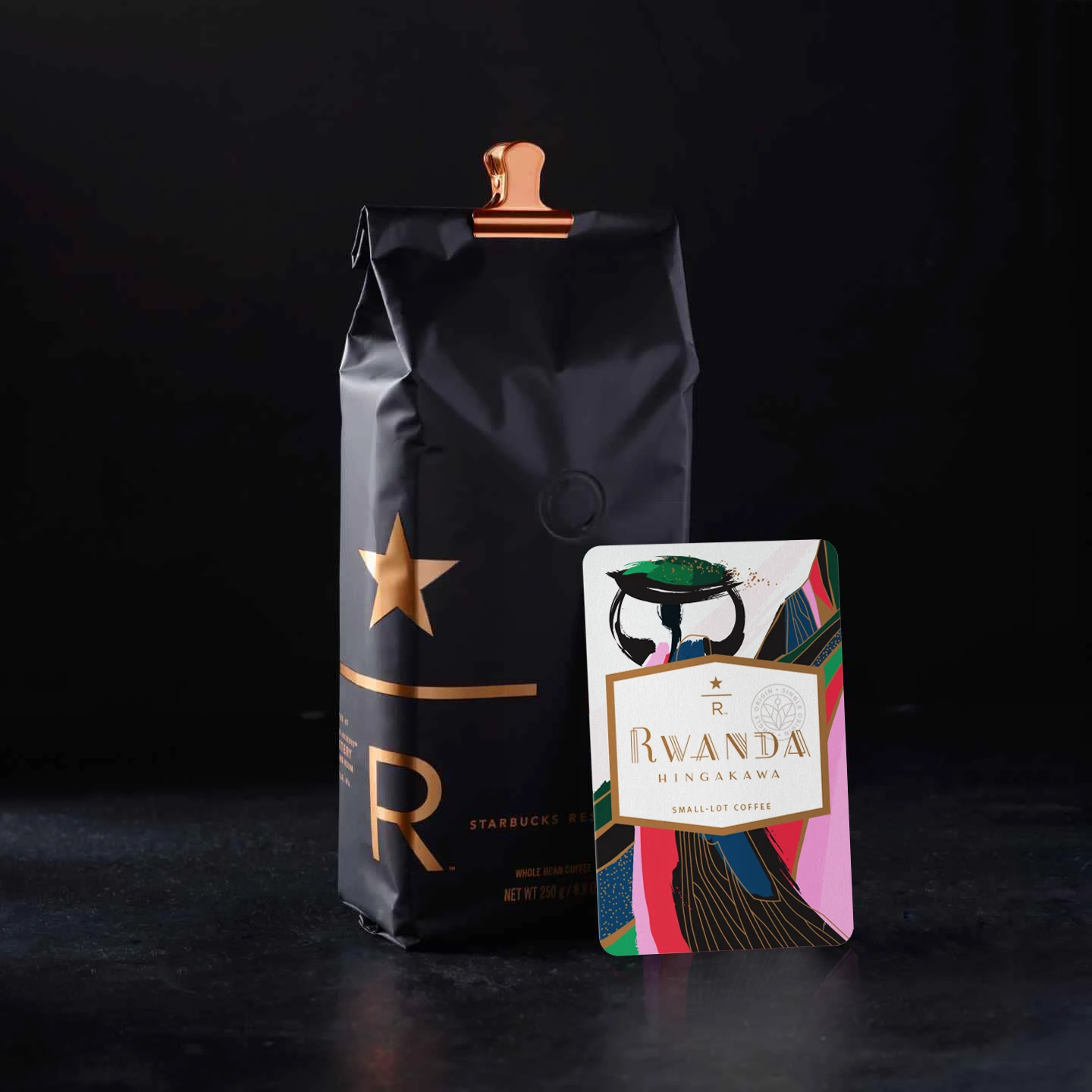   Farmer’s Story   A group of farmers known as Hingakawa— all of whom are women —are turning out coffees of rare elegance. After bearing witness to one of Rwanda’s darkest episodes, the farmers of Hingakawa found a path forward through coffee—one that embraces reconciliation, revitalization and improved livelihoods. Hingakawa, a mantra that translates to “Let’s grow coffee,” is a product of patience, care and love.   Artist’s Story   I still can’t believe that this association is made entirely of women in a historically male dominated country. Because of that I knew I had to have HER – the female farmer – at the forefront of my art. The basket represents the idea that Rwandan women are a strong, tightly woven unit, bringing stability to their economy and keeping their families bound together. Her dress mimics the valley and mountain behind her as a nod to her new craft; by harvesting nature in the form of coffee beans, she is rebuilding her nation literally from the ground up. I wanted this card to feel vibrant and powerful - just like her. 